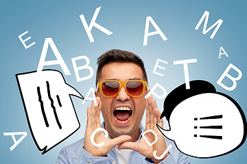 Image showing face of angry shouting man in sunglasses with text