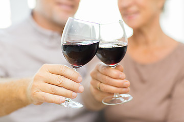 Image showing close up of happy senior couple with red wine