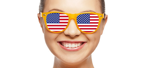 Image showing happy teenage girl in glasses with american flag