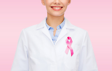 Image showing smiling female doctor with cancer awareness ribbon