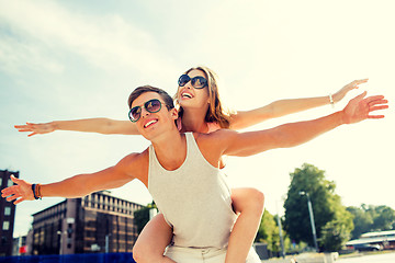Image showing smiling couple having fun in city