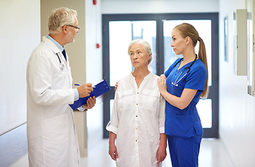 Image showing medics and senior patient woman at hospital