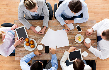 Image showing close up of business team drinking coffee on lunch