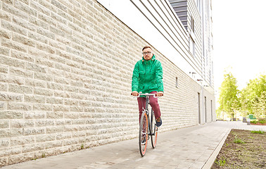 Image showing young hipster man riding fixed gear bike