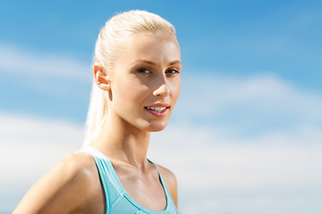 Image showing happy young sporty woman outside