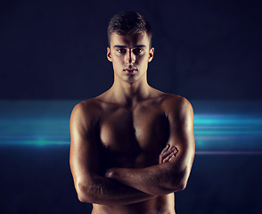 Image showing young male bodybuilder with bare muscular torso