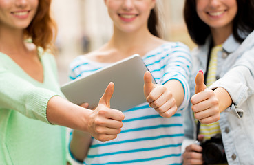 Image showing women with tablet pc showing thumbs up