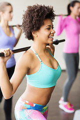 Image showing group of people exercising with bars in gym