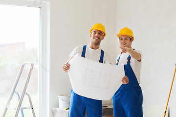 Image showing group of builders with blueprint