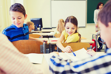 Image showing group of school kids writing test in classroom