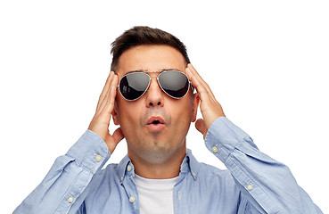 Image showing face of scared man in shirt and sunglasses