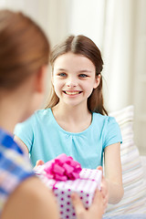 Image showing happy little girls with birthday present at home