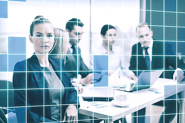 Image showing businesswoman and business team at office the back