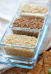 Image showing close up of grain in glass bowls on wooden table