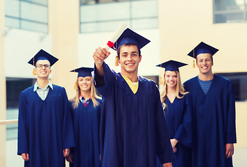 Image showing group of smiling students in mortarboards