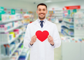 Image showing male pharmacist with heart at drugstore