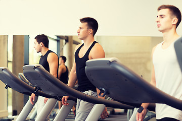 Image showing group of men exercising on treadmill in gym