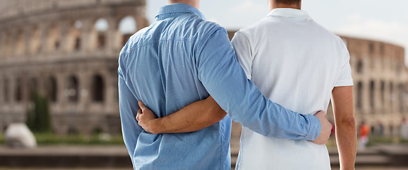 Image showing close up of male gay couple over coliseum in rome