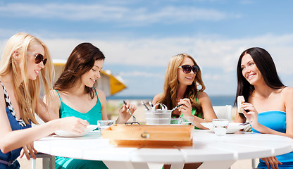 Image showing girls in cafe on the beach