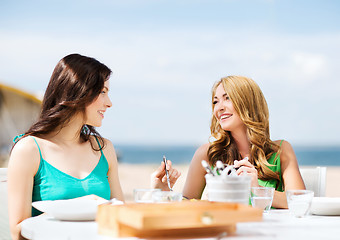 Image showing girls in cafe on the beach