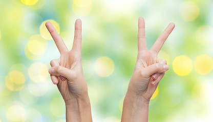 Image showing woman hands showing victory or peace sign