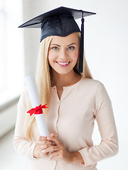 Image showing student in graduation cap with certificate