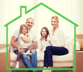 Image showing smiling parents and two little girls at new home