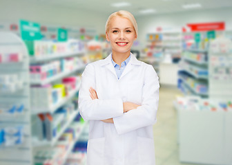 Image showing young woman pharmacist drugstore or pharmacy