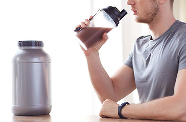 Image showing close up of man drinking protein shake