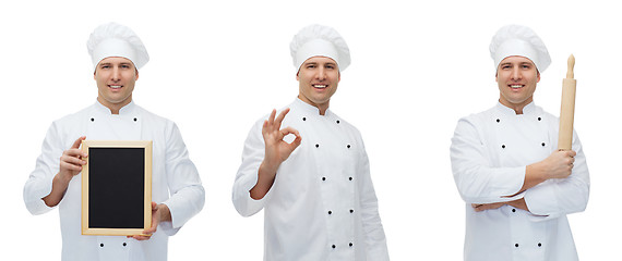 Image showing happy male chef baker with menu board showing ok