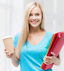 Image showing smiling student with folders