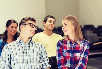 Image showing group of smiling students in lecture hall