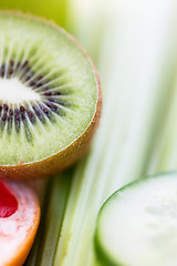 Image showing close up of ripe kiwi and cucumber slices