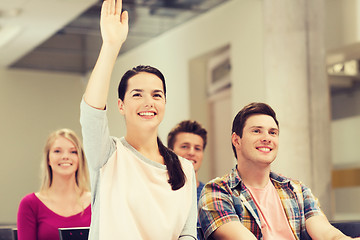 Image showing group of smiling students in lecture hall