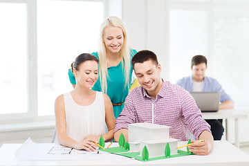 Image showing smiling architects working in office