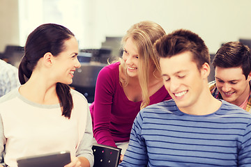 Image showing group of smiling students with tablet pc