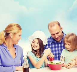 Image showing happy family with two kids eating at home