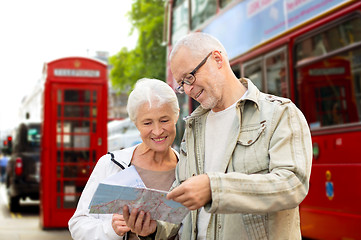 Image showing senior couple with map on london in city street