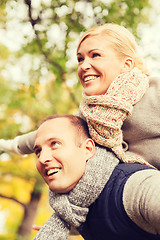 Image showing smiling couple having fun in autumn park