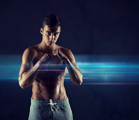 Image showing young man in fighting or boxing position