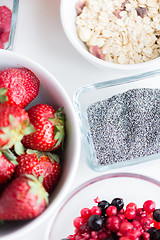 Image showing close up of fruits and berries in bowl on table