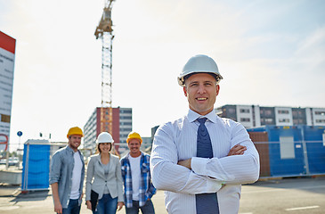 Image showing happy builders and architect at construction site