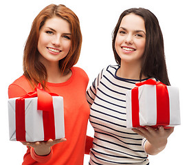 Image showing two smiling teenage girls with presents