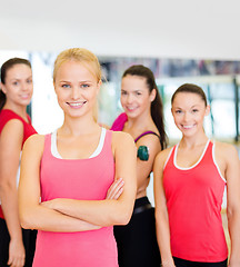 Image showing woman standing in front of the group in gym