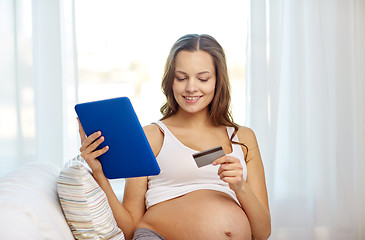 Image showing pregnant woman with tablet pc and credit card