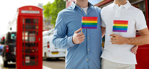 Image showing close up of gay couple hugging over london city