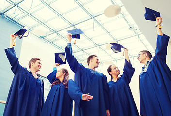 Image showing group of smiling students in mortarboards