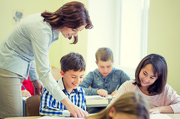 Image showing group of school kids writing test in classroom