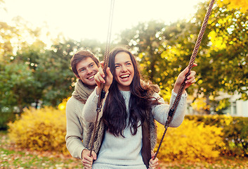 Image showing smiling couple hugging in autumn park