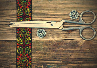 Image showing antique embroidered tape, vintage buttons and a tailor scissors